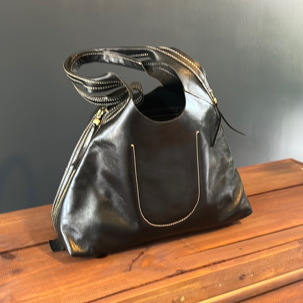 Chic Black Leather Handbag made by HOBO